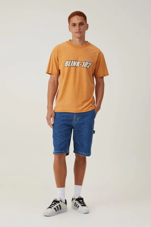 Men Graphic TShirts Cotton On Blink 182 Loose Fit TShirt Lcn Mt Buckskin Goldtech Logo